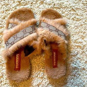 Faux Gucci Sliiper, size 7 but fits size 6!  Worn handful of times!